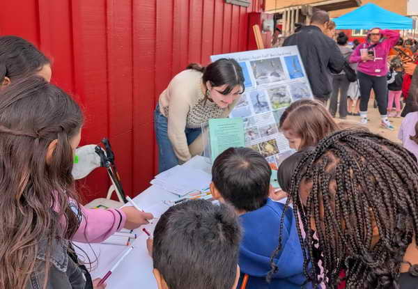 Kids draw critters at Waterside Workshops Youth Festival